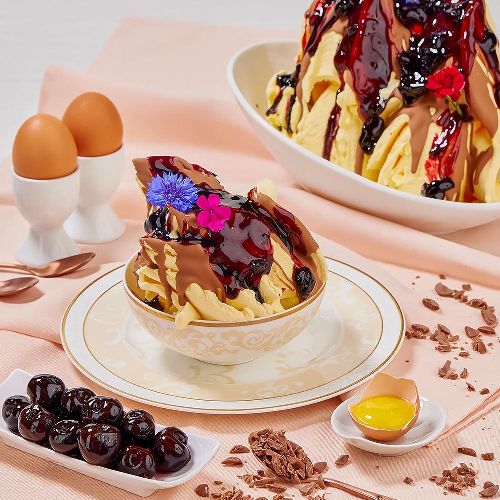 Dessert bowl with waffles, chocolate sauce, and berries