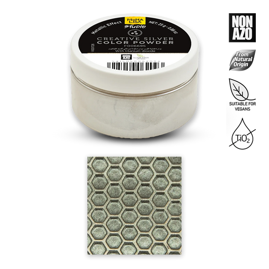 A tub of Rubie's Creative Silver Color Powder shown on a white background, with a small inset swatch of the powder's textured silver-gray appearance below the container.右侧 includes Non-Azo, natural origin, suitable for vegans, and H2O2 certification icons.