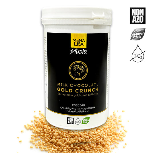 Mona Lisa Studio Milk Chocolate Gold Crunch packaging with gold crunch pieces around.