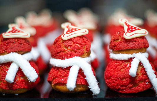 Santa Claus Shaped Choux Pastry with Raspberry Filling for Christmas