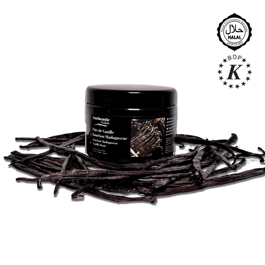 Black container of vanilla powder on vanilla beans with BDP K logo
