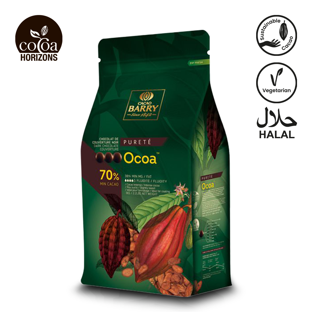 Green packaging of Ocoa chocolate with cacao beans and branding on a white background