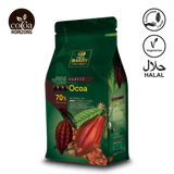 Green packaging of Ocoa chocolate with cacao beans and branding on a white background