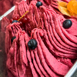 EVS05005_Fruit_Sorbet_Base_Powder Close-up of a pink dessert with blueberries and red berries