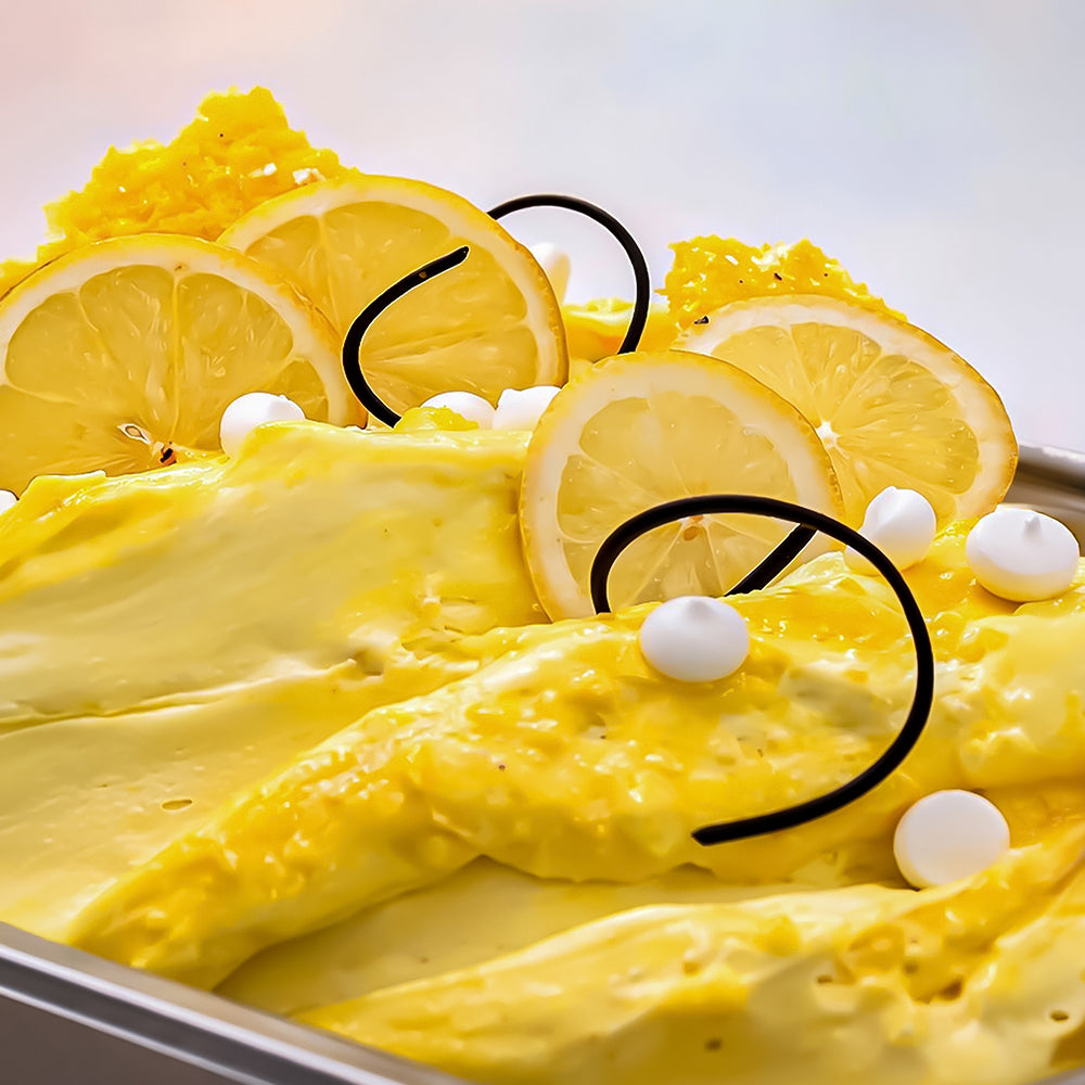 Yellow dessert with lemon slices and white pearls Ice Cream Gelato