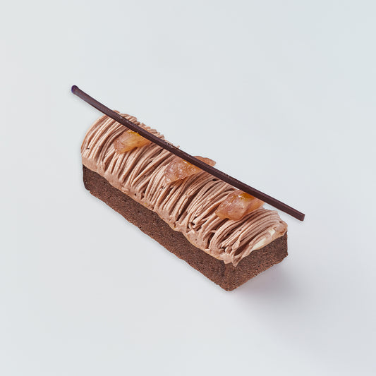Delicate dessert with chocolate and cream on a light gray background