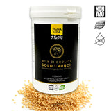 Mona Lisa Studio Milk Chocolate Gold Crunch packaging with gold crunch pieces around.