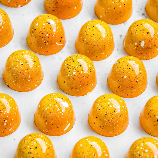 yellow bonbons coloured with power flower Dessert
