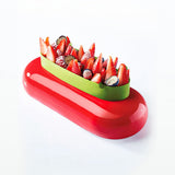 Fruit salad in a red and green container on a white background