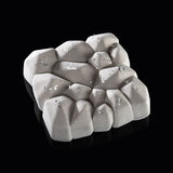 Textured stone-like object on a black background