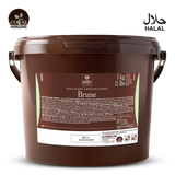 Brown bucket labeled 'Brune' with 'Cocoa Horizons' branding on a white background