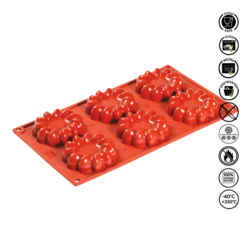 Red silicone mold with star-shaped cavities on a white background