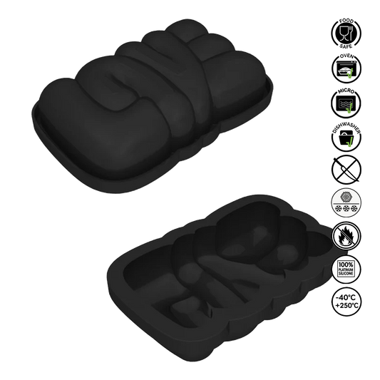 Black silicone bread mold with multiple compartments on a white background