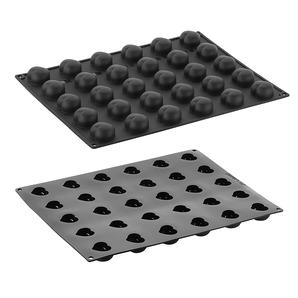 Two black silicone mold trays on a white background