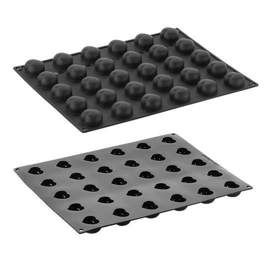 Two black silicone mold trays on a white background