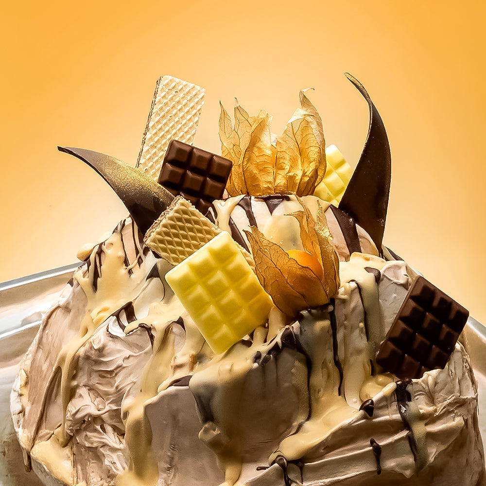 Delicate dessert with chocolate, white chocolate, and other elements on a light background