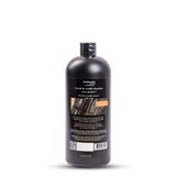 Bottle of vanilla extract with a label on a white background